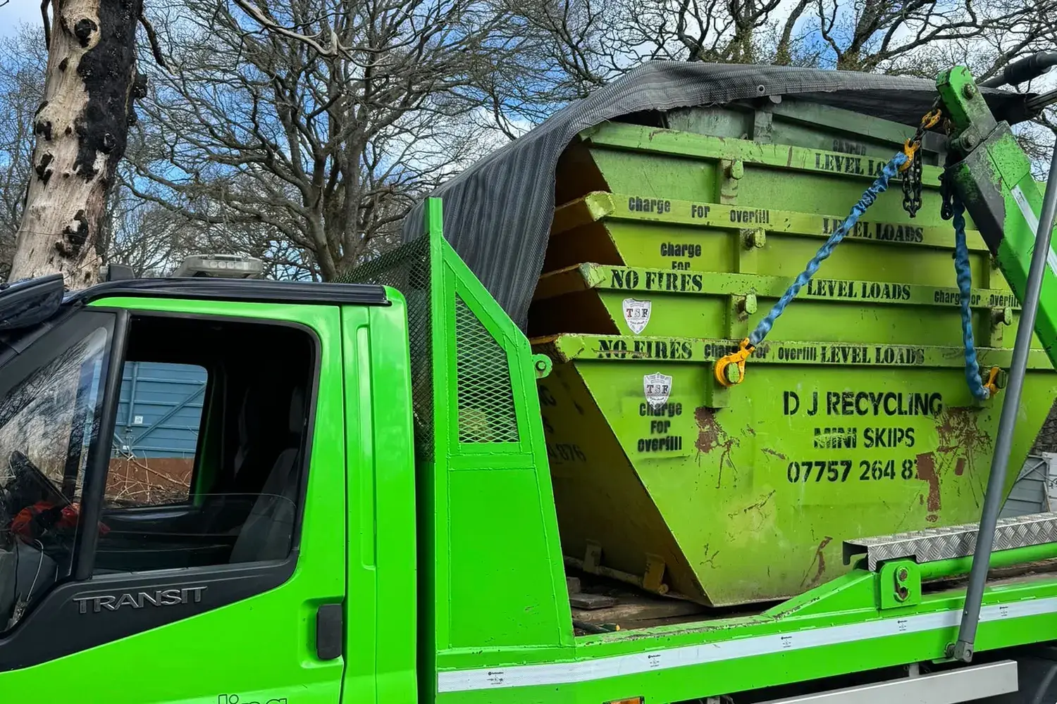 Stacked DJ Recycling mini skips on a skip lorry