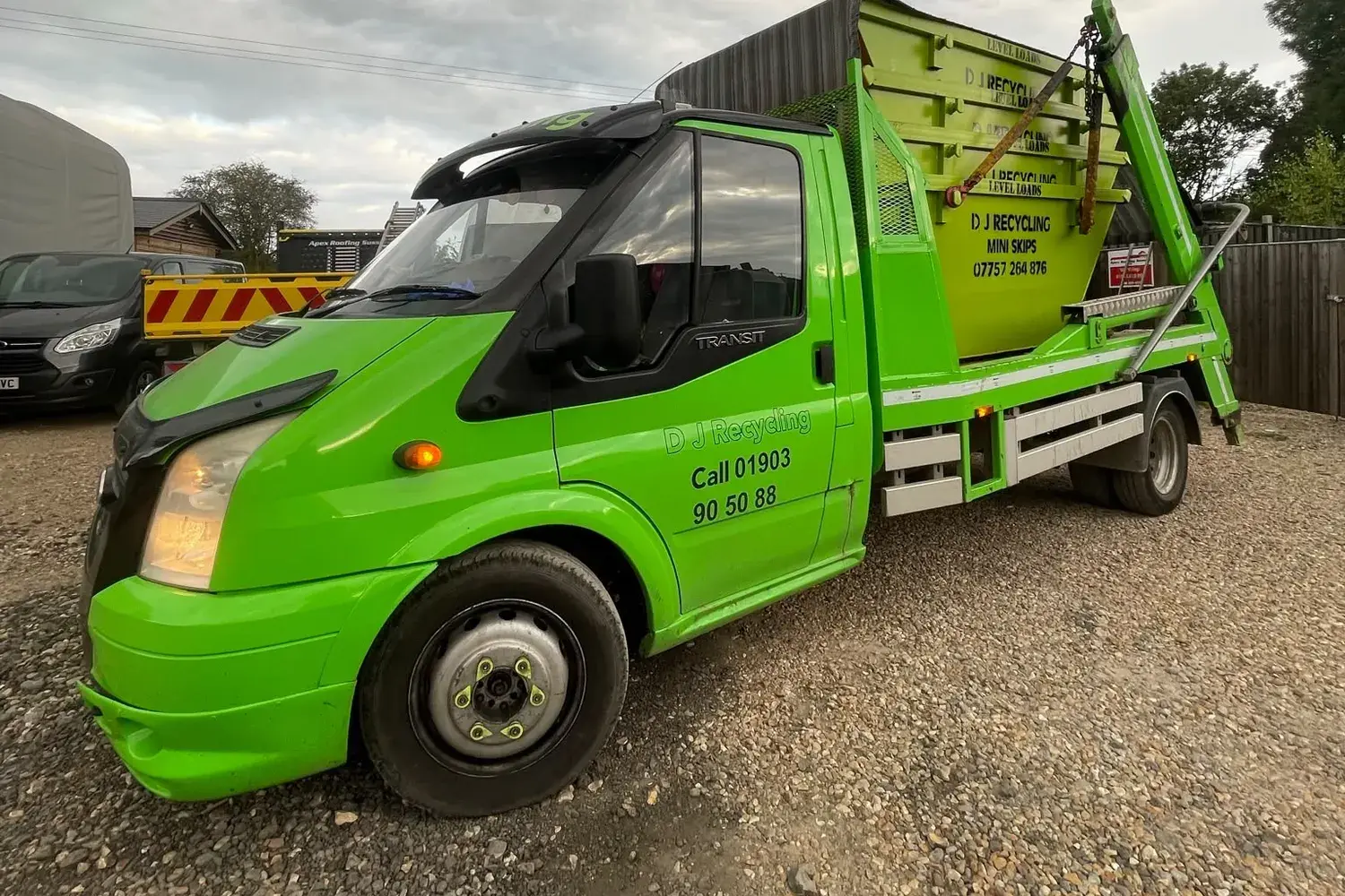 DJ Recycling skip lorry on a gravel yard